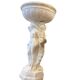 Vintage white concrete garden statue adorned with planter.