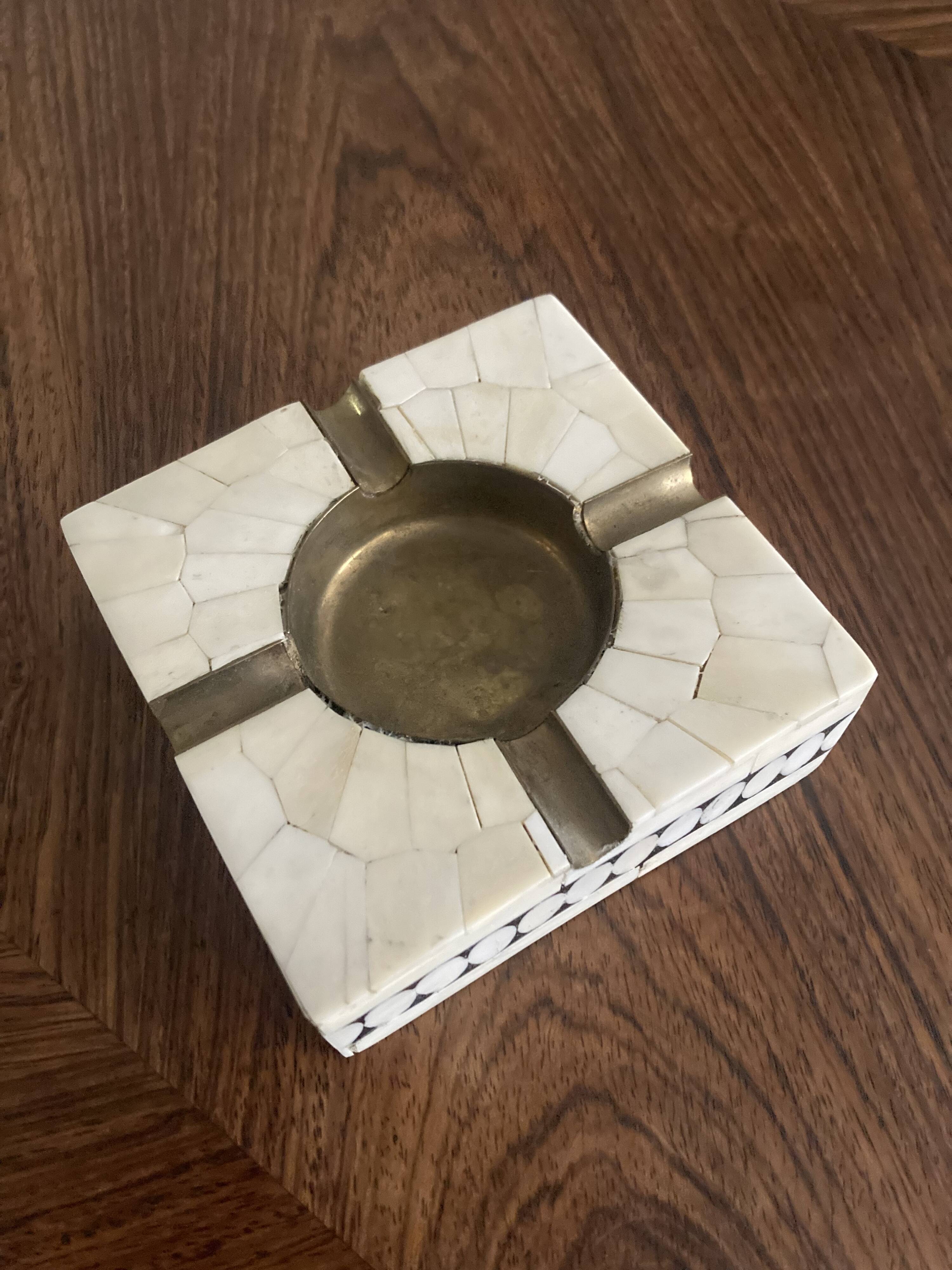 Bone and brass ashtray