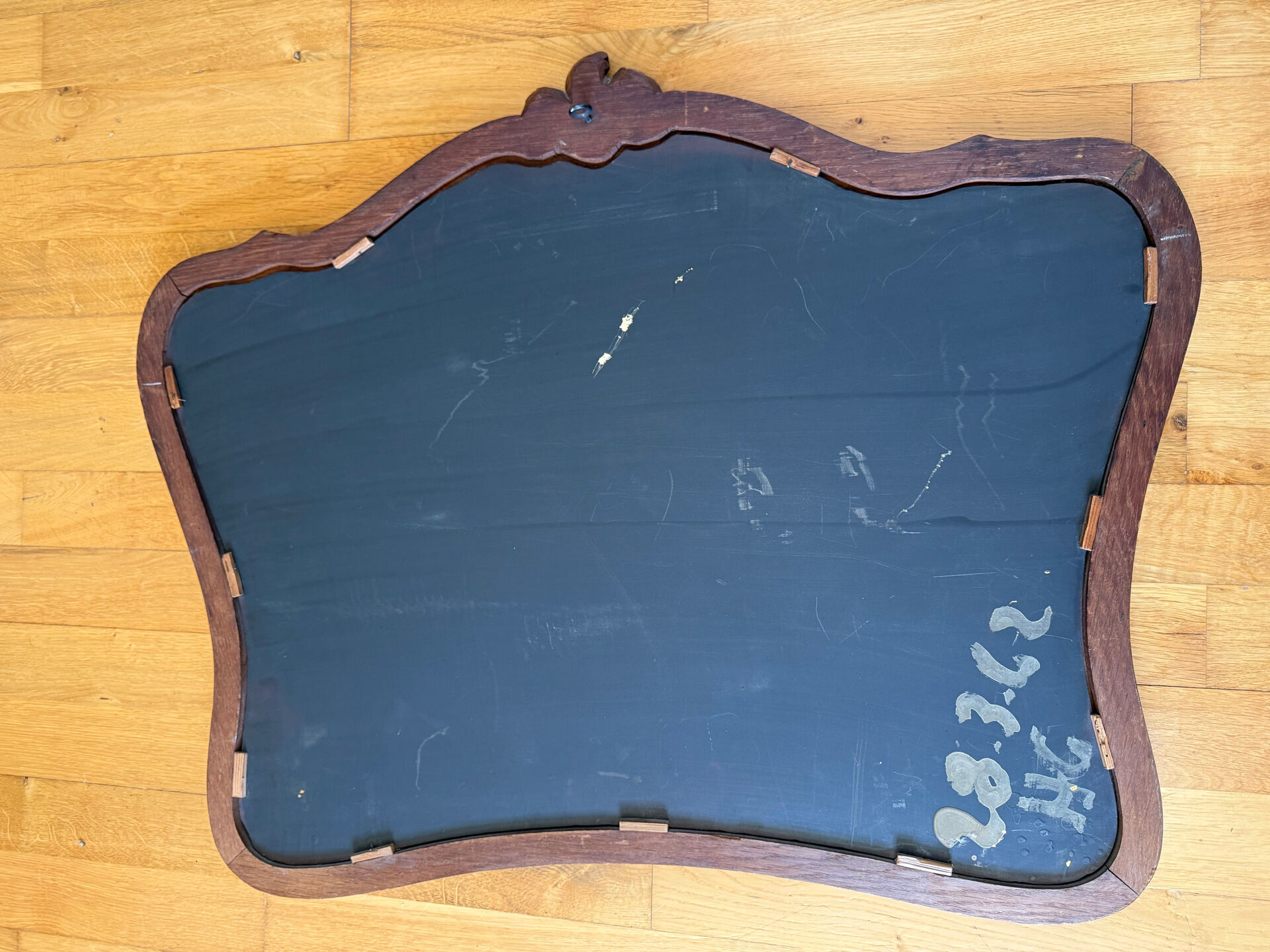 Antique bevelled mirror, oak frame