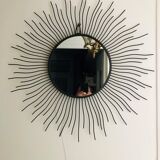 Sun mirror in black lacquered metal