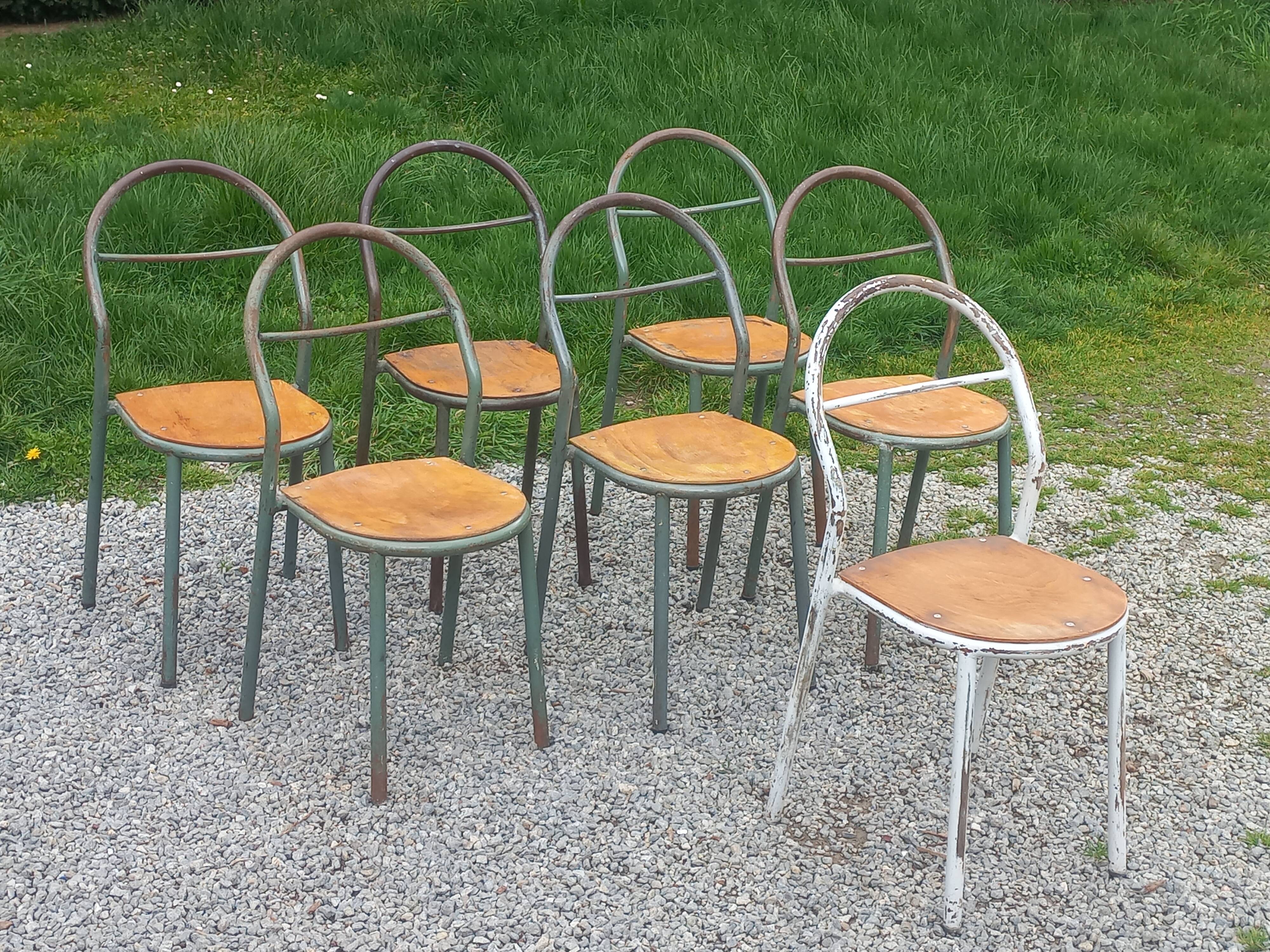 Set de 7 chaises de René Herbst métalliques assises bois