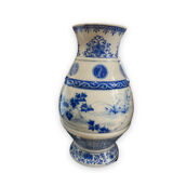 Pair of Asian vases in white and blue porcelain