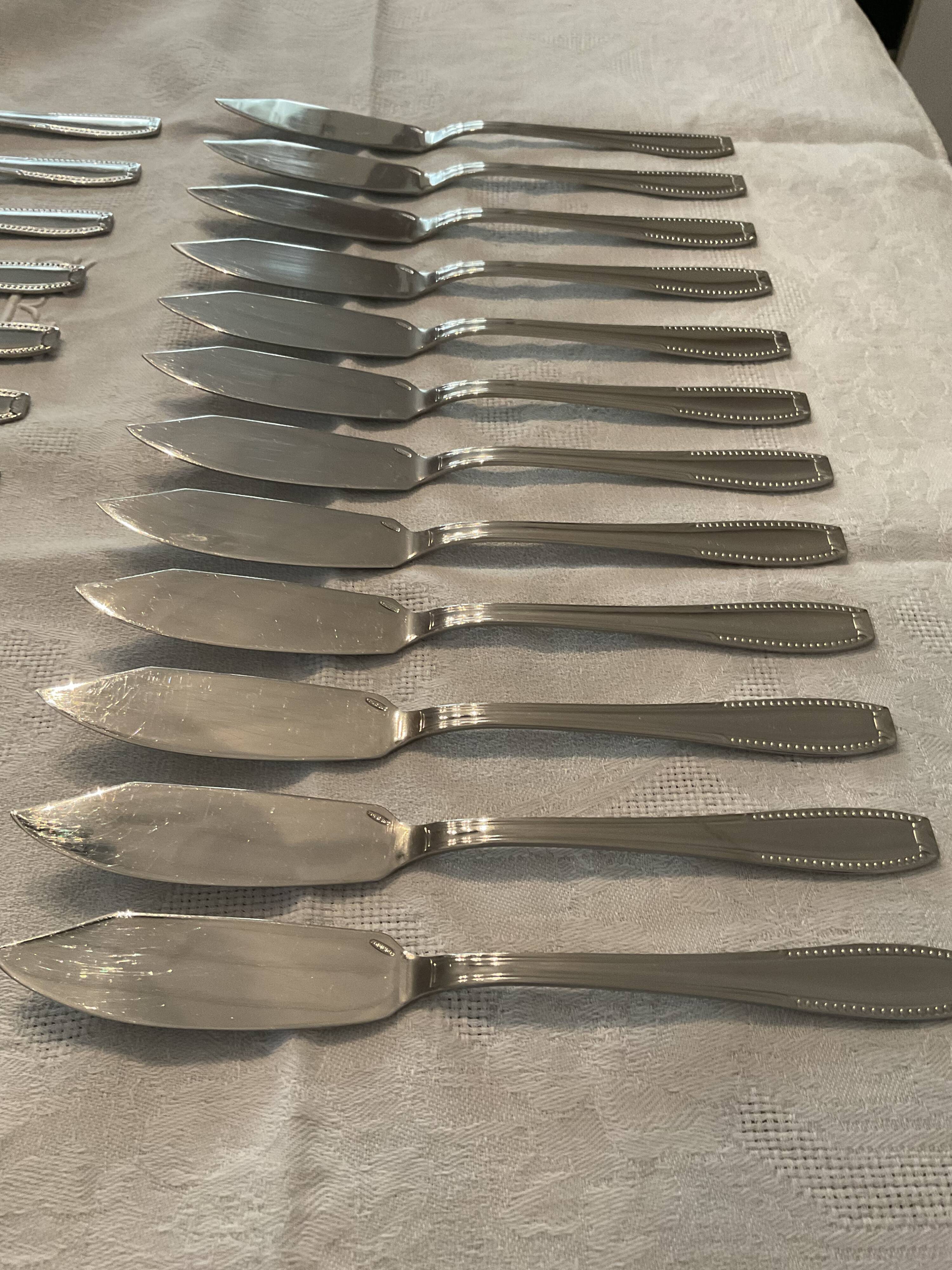 24 fish covers. Forks and knives . Stainless steel. Vintage