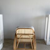 Large rattan rest chair and white cushions