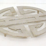 Under the geometric plate opened