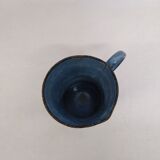 Old blue enamelled pitcher with spout