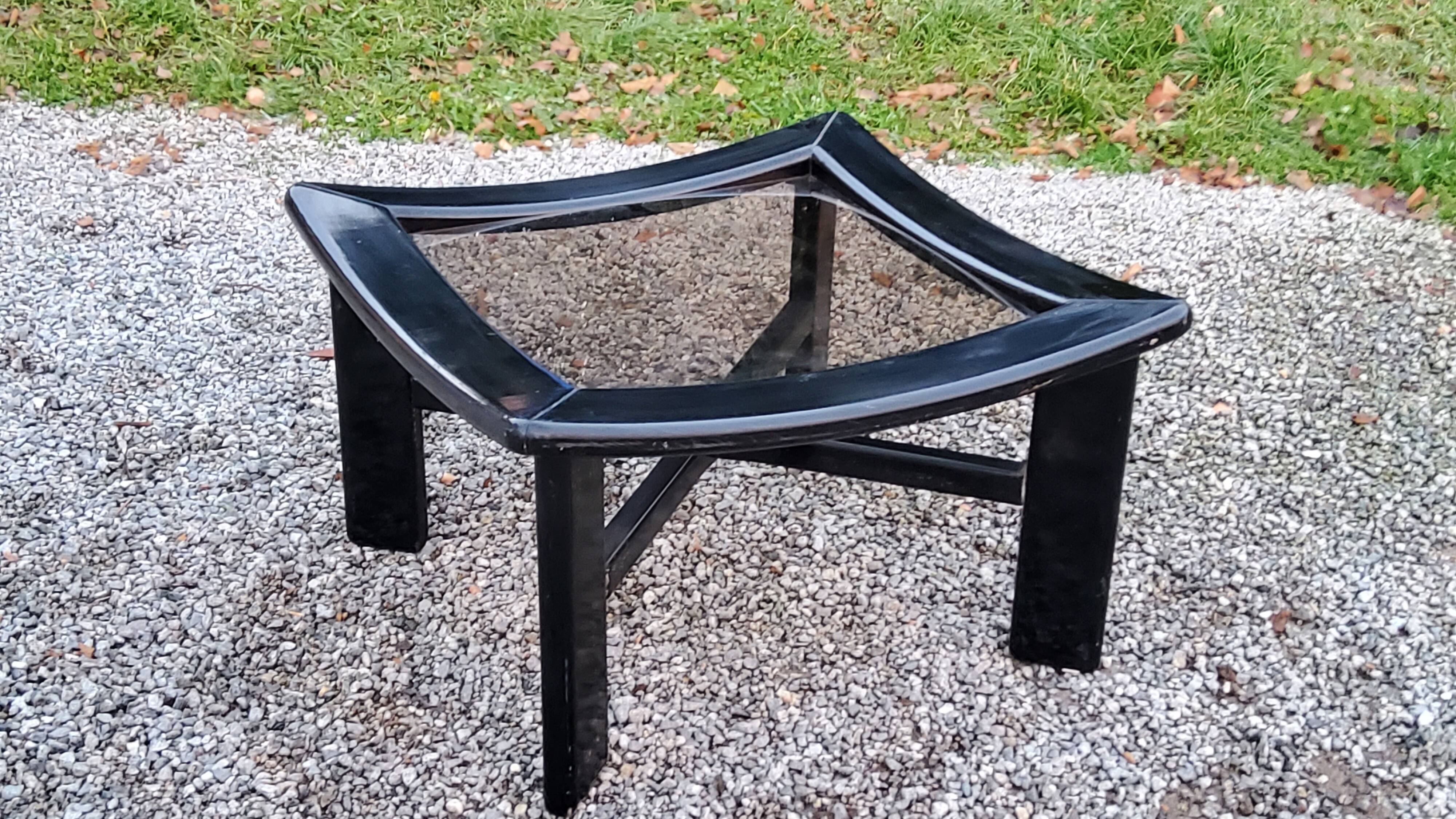 70s design coffee table in black lacquered wood with smoked glass top