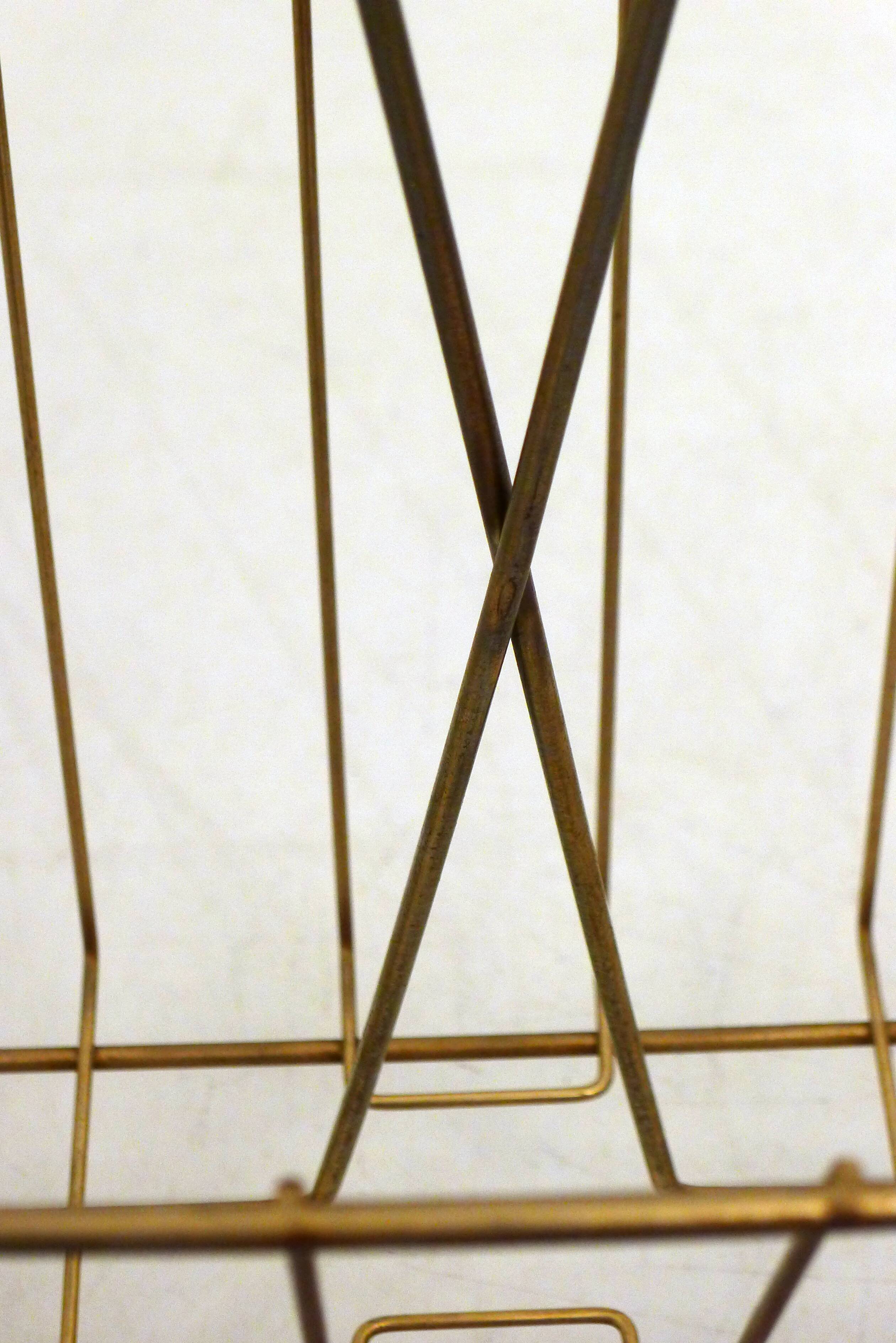 Mid-century openwork magazine rack, in gold metal & wooden handle.
