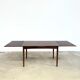 Rosewood dining table with integrated extensions — Denmark, 1960s