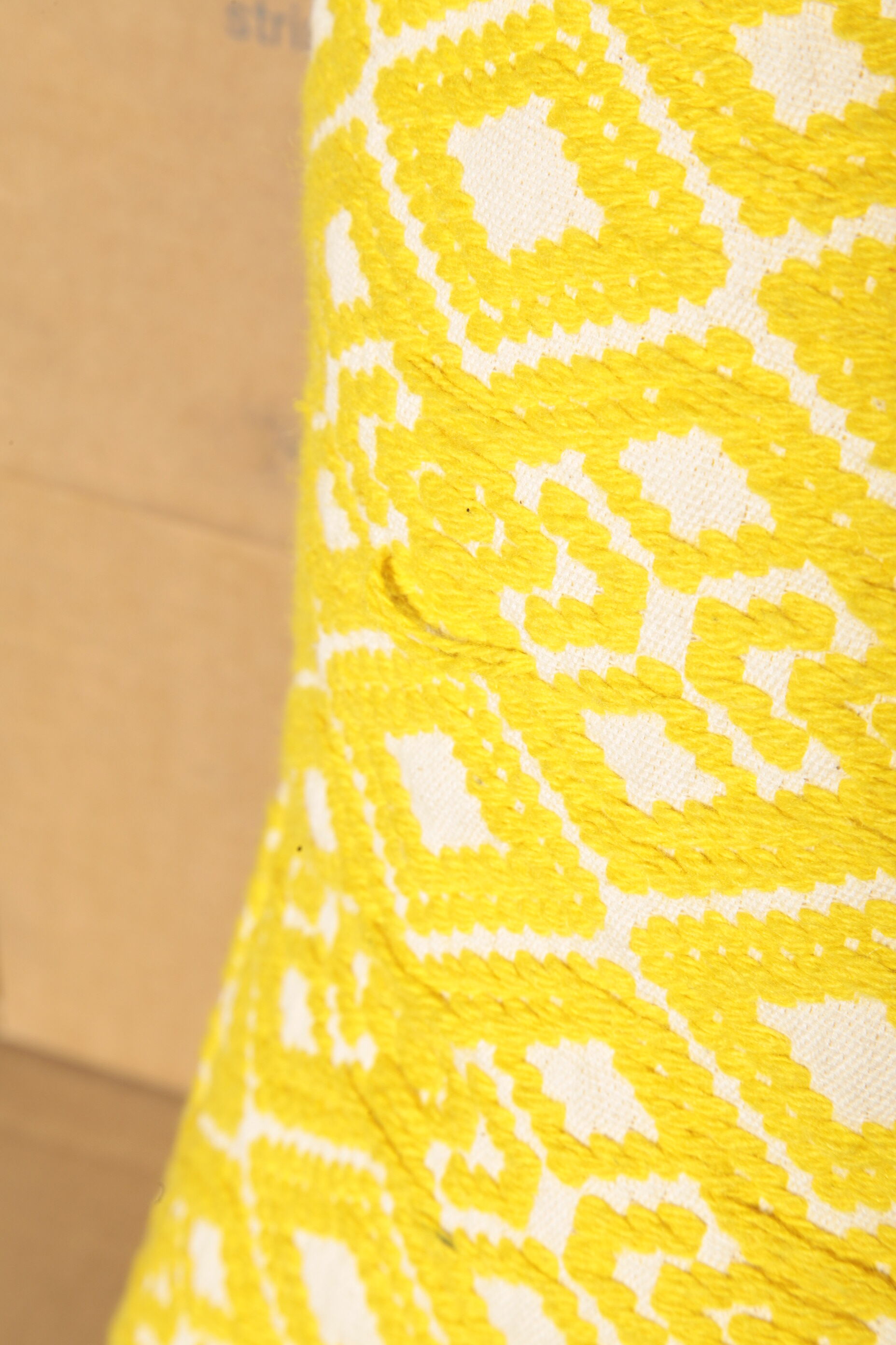 Yellow diamond knit cushion