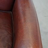 Sheepskin armchair correctly finished with decorative nails and in good condition