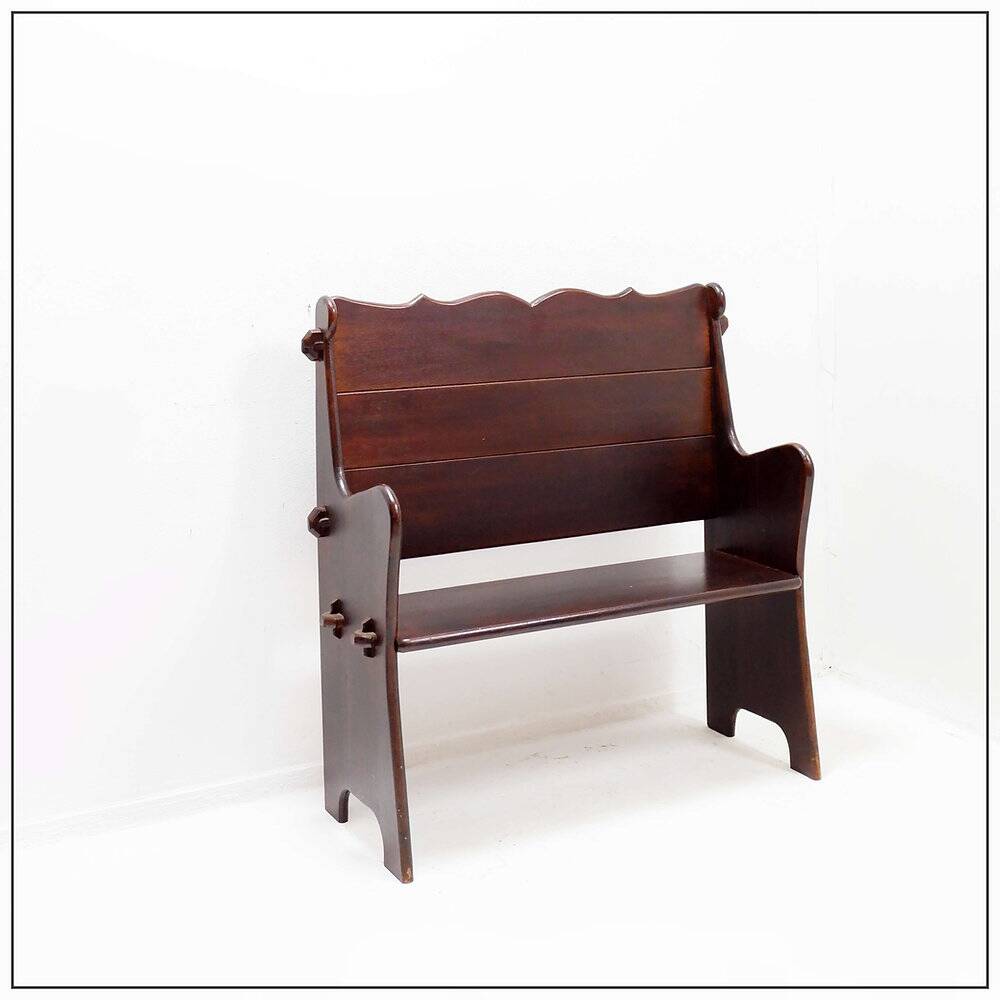 Vintage solid wood church bench from the 20th century.