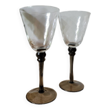 Two smoked black stem wine glasses