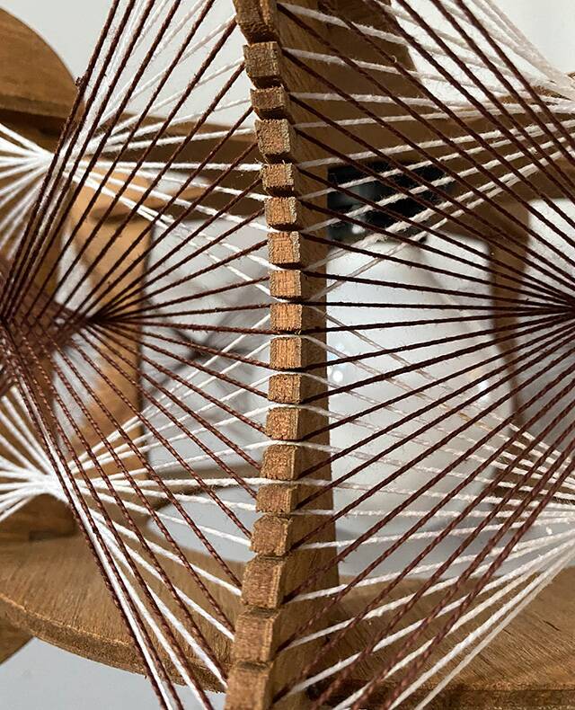 Hanging wood and stretched wire