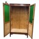 Vintage wooden display cabinet with green glass.