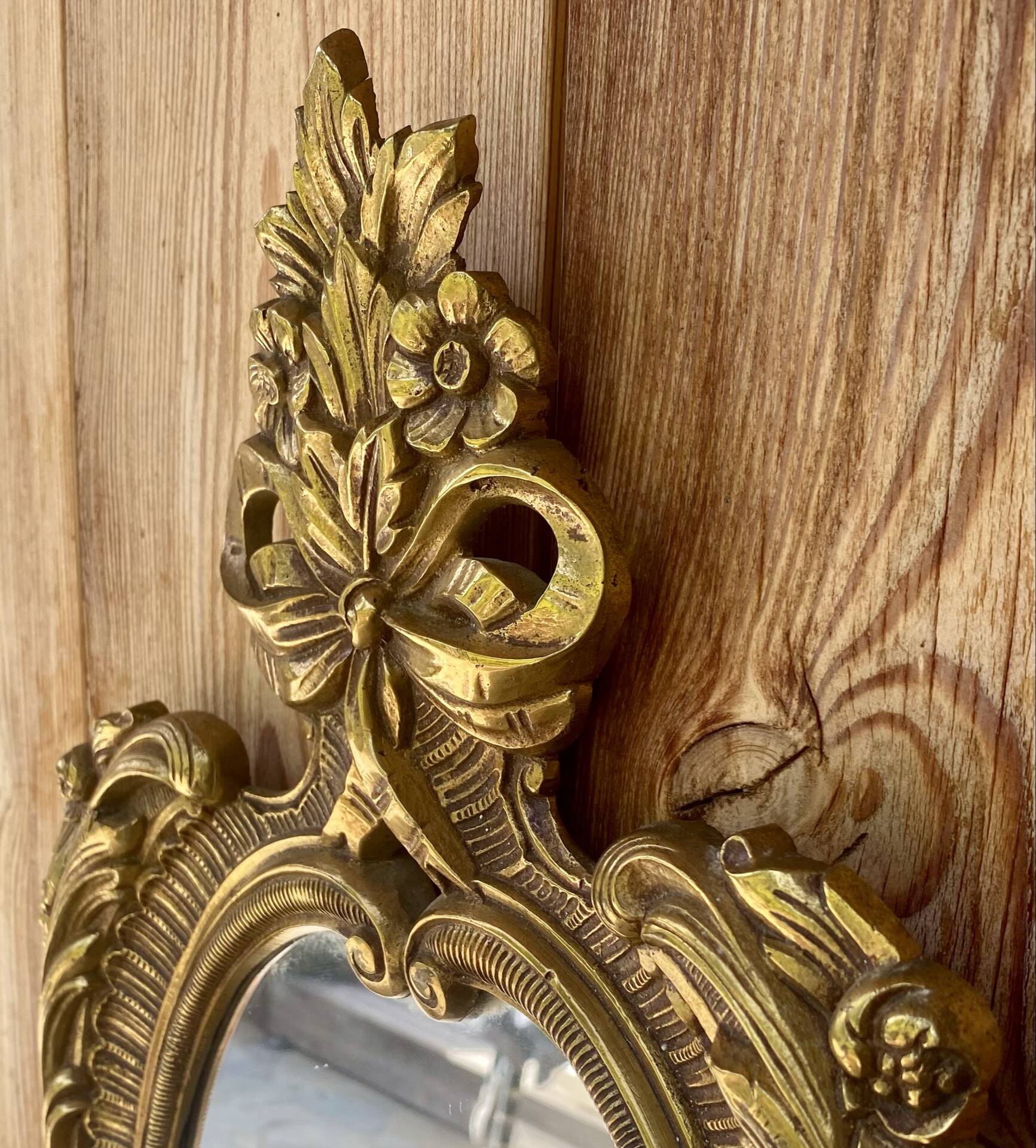 oval decorative wall mirror in Louis XV style