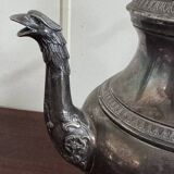 Empire style silver-plated verseuse, resting on three sculpted feet.