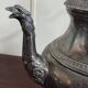 Empire style silver-plated verseuse, resting on three sculpted feet.