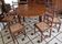 Extendable walnut table, 6 caned chairs in Henri II Neo-Renaissance style.