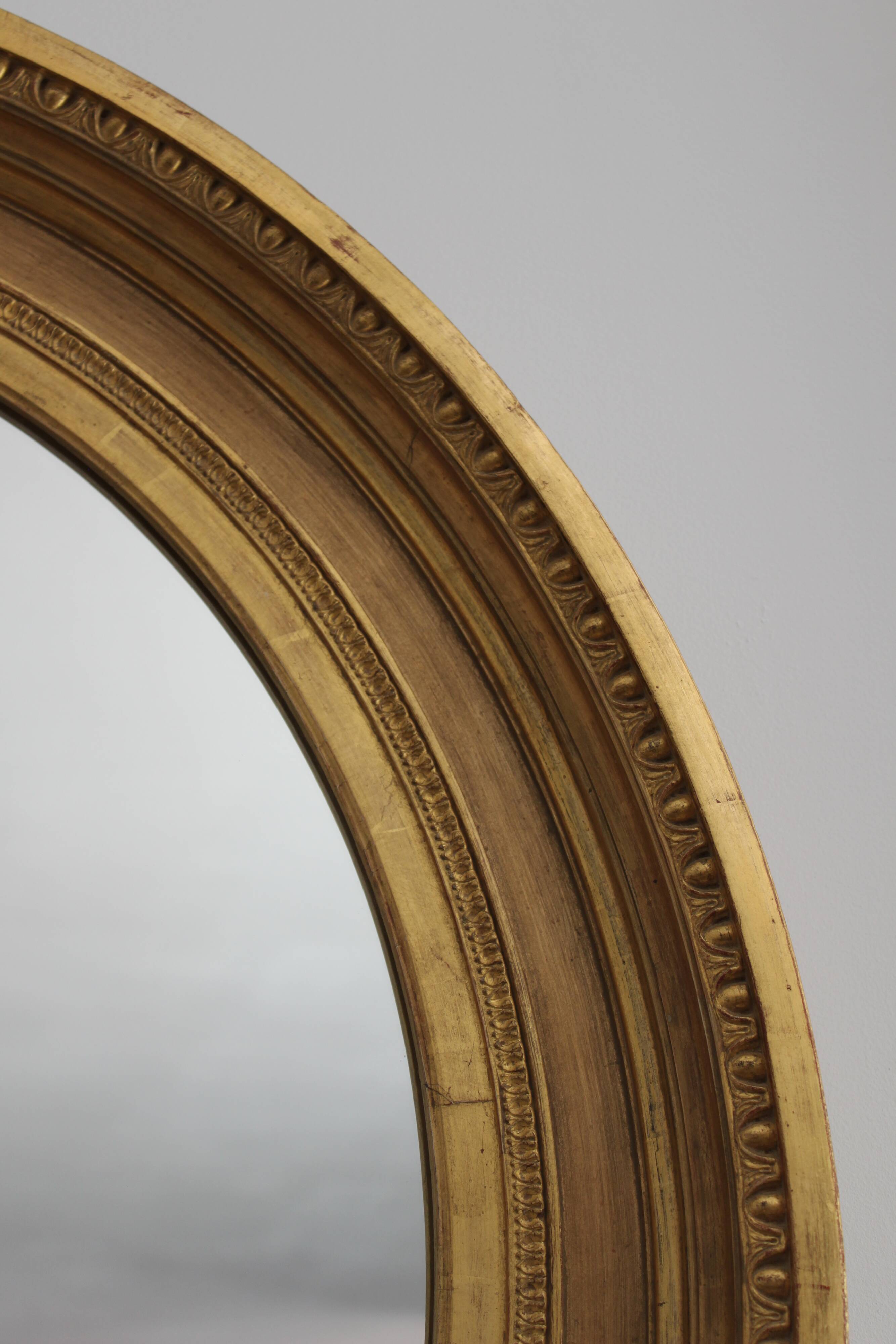 Mirror antique medallion gilded with gold leaf