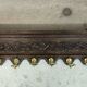 Vintage wall-mounted coat rack in solid wood.