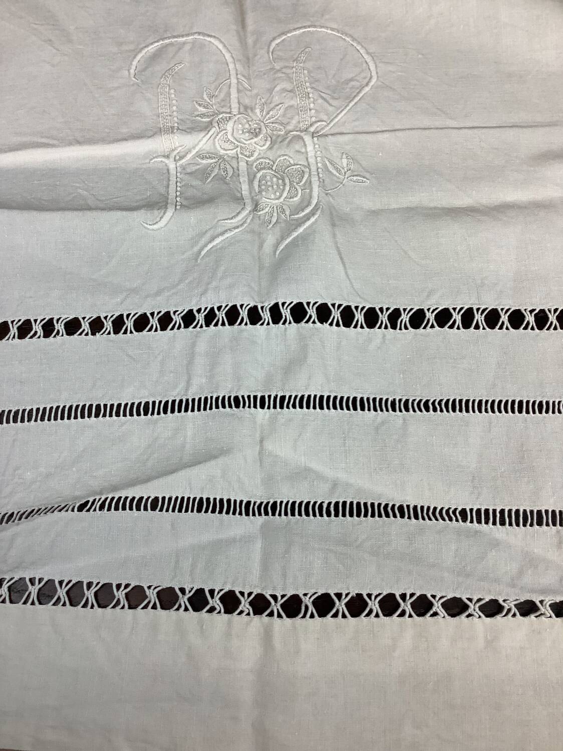 Old linen sheet with monogram embroidery