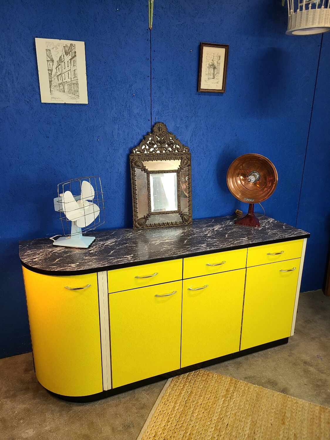 Vintage yellow sideboard, and black marble top.