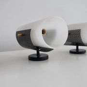 Set of four wall lights in white plexiglass and perforated black metal.