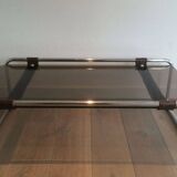 Coffee table in chrome, leather, and smoked glass