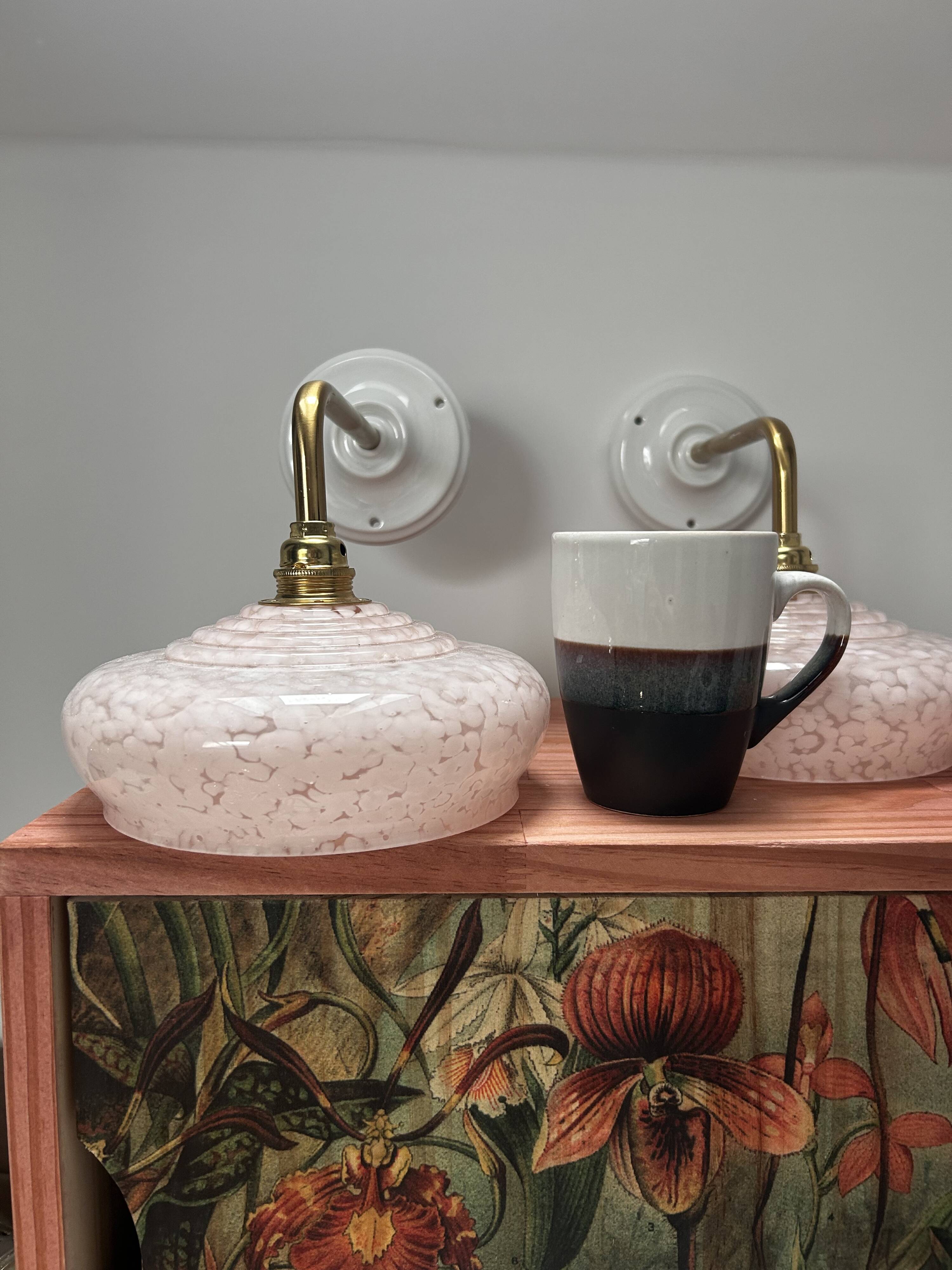 Pair of pink globe wall lights