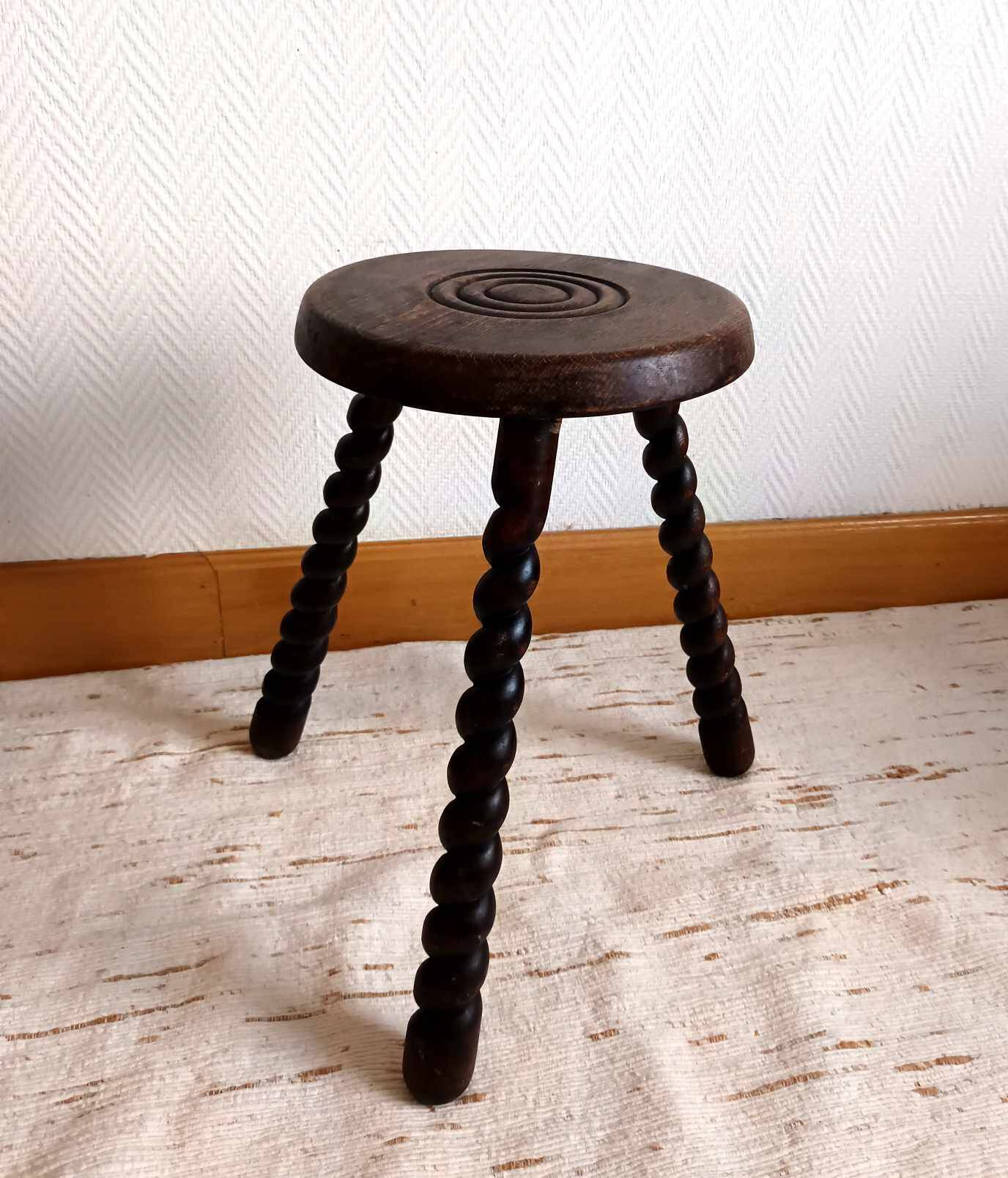 Brutalist tripod stool with twisted legs