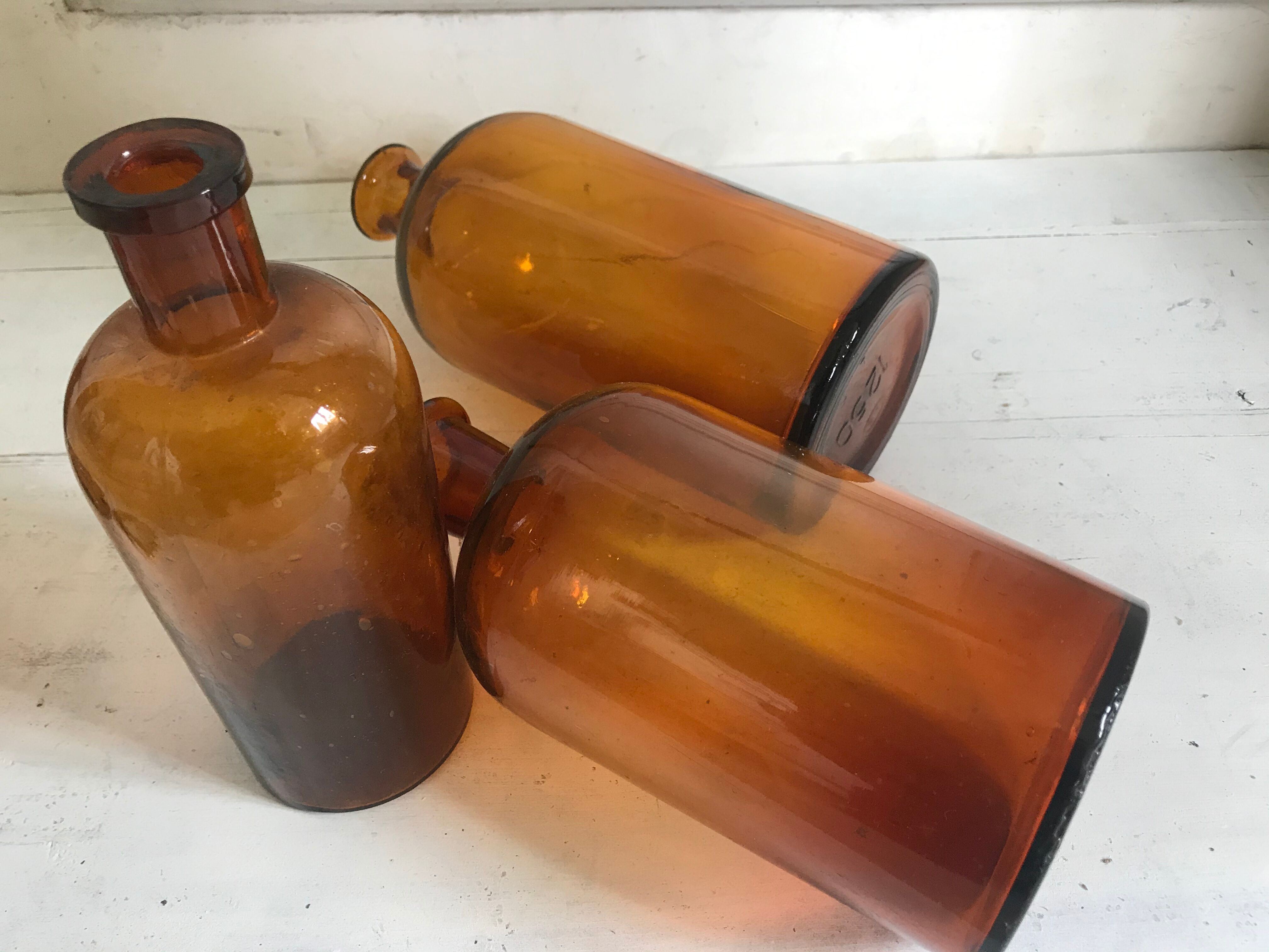 Trio of apothecary bottles