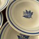Set of 6 vintage deep plates in earthenware with blue lily of the valley flowers.