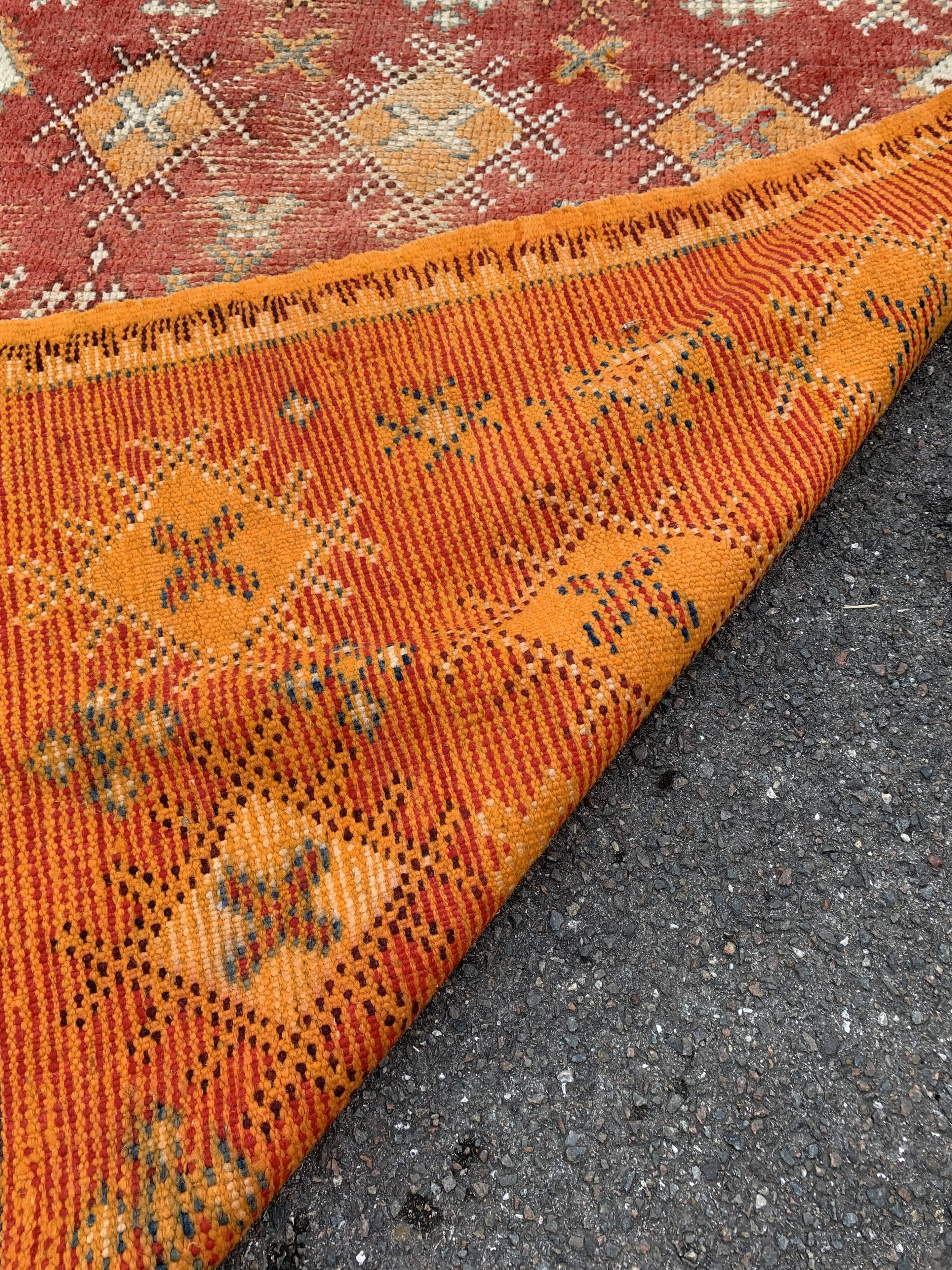 Old orange kilim carpet