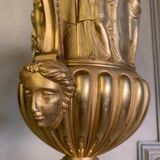 Golden bronze urn, base of red griotte marble.