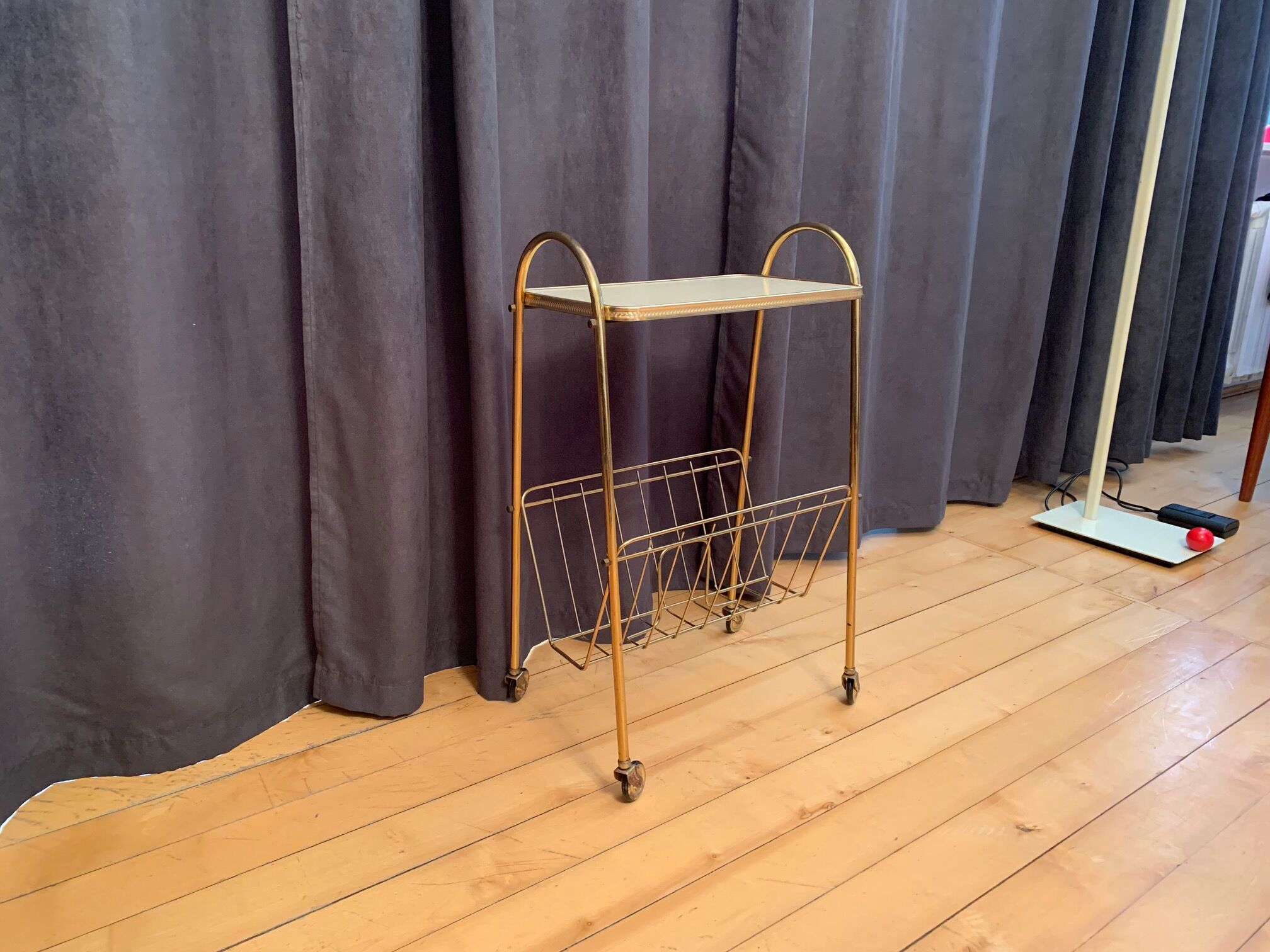 Mobile newspaper holder, 1960s