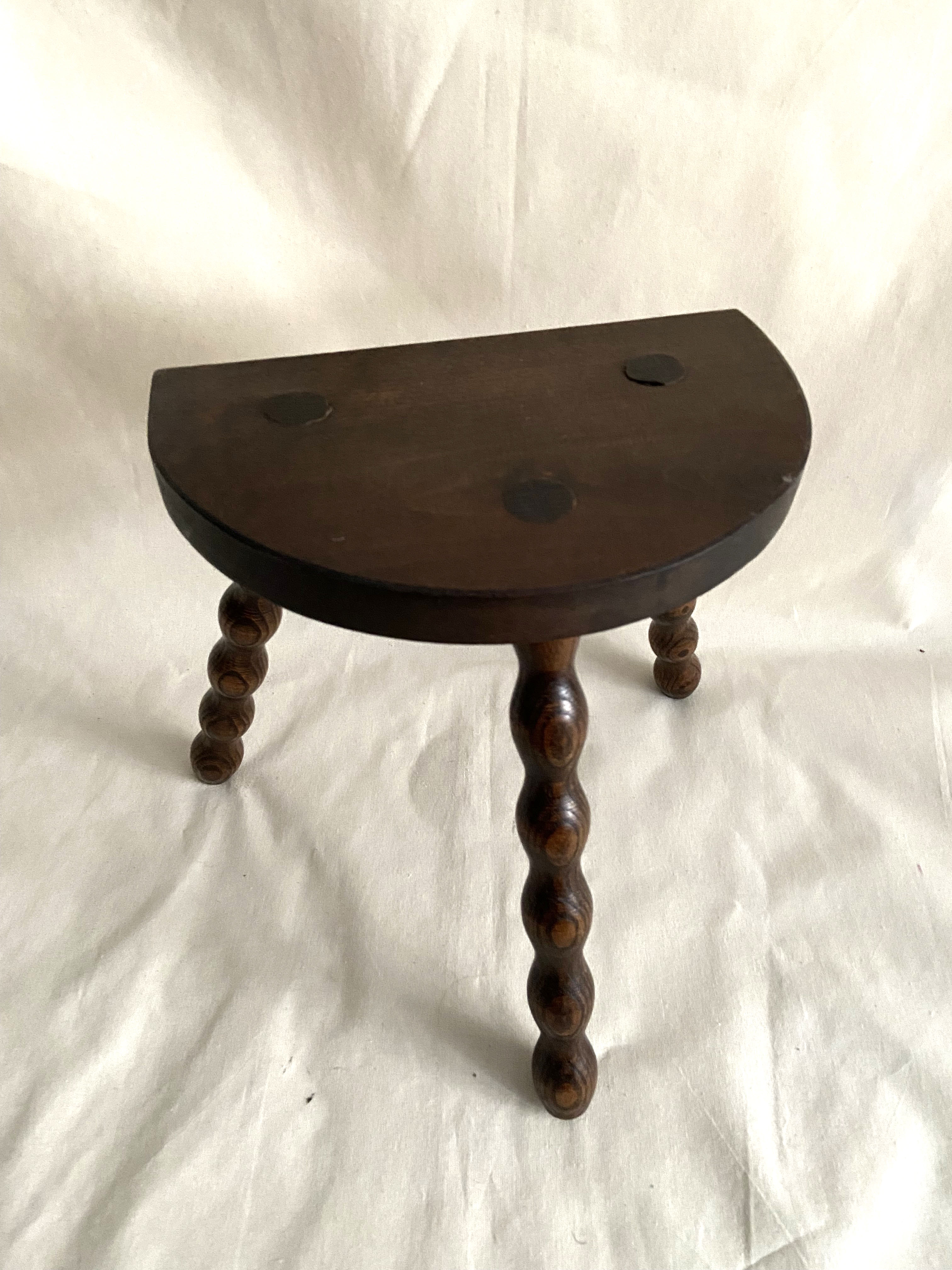 Tripod stool in turned wood