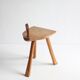 Brutalist tripod stool in carved wood, 1950s
