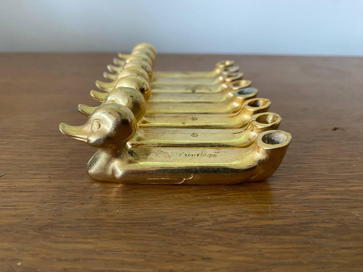 Set of 8 antique privilege knife holders gold metal duck vintage