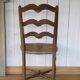 Antique chair with coloured rush seating.