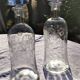 Two antique engraved glass bottles