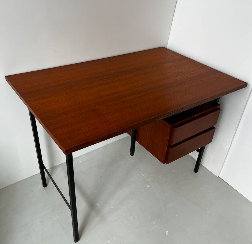 Vintage wooden and metal desk in modernist style.