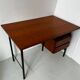 Vintage wooden and metal desk in modernist style.