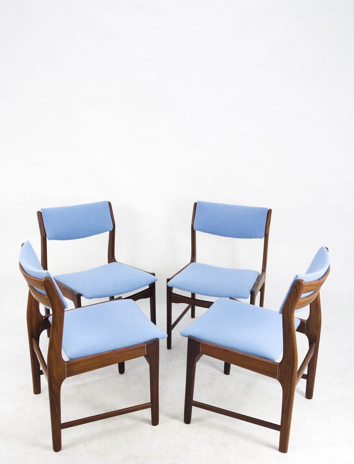 A set of 4 teak dining chairs,