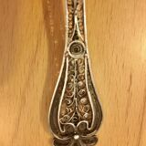 silver sprinkler spoon