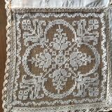 Former embroidered doily