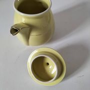 Vintage teapot in pastel yellow earthenware with gold trim