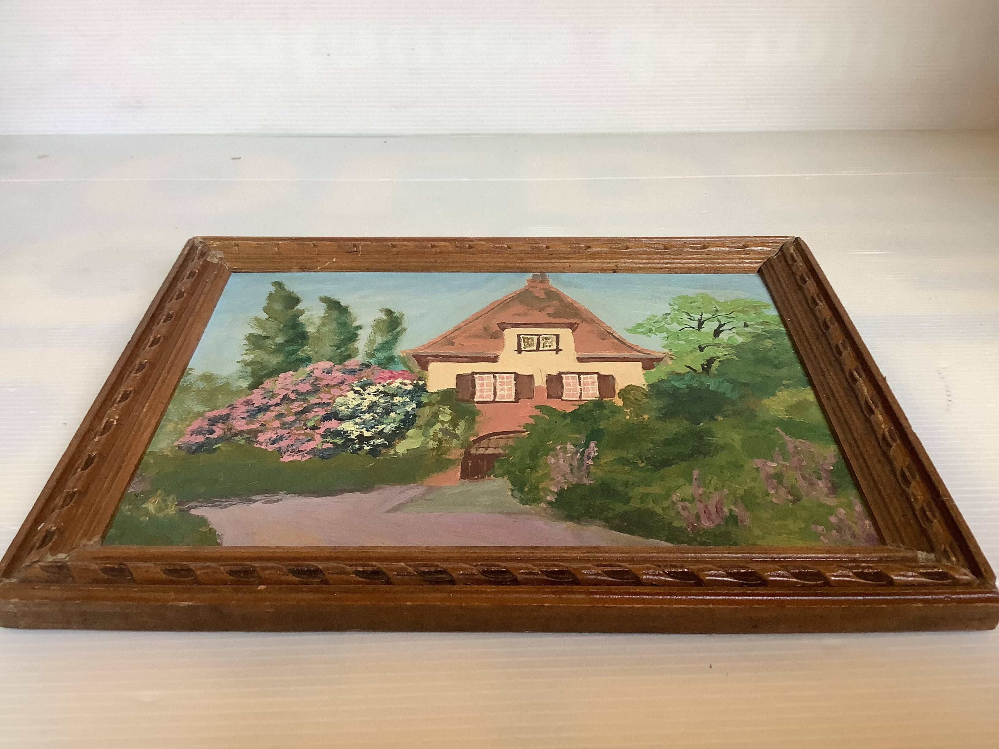 Small painting of a flowered house in oil on cardboard.