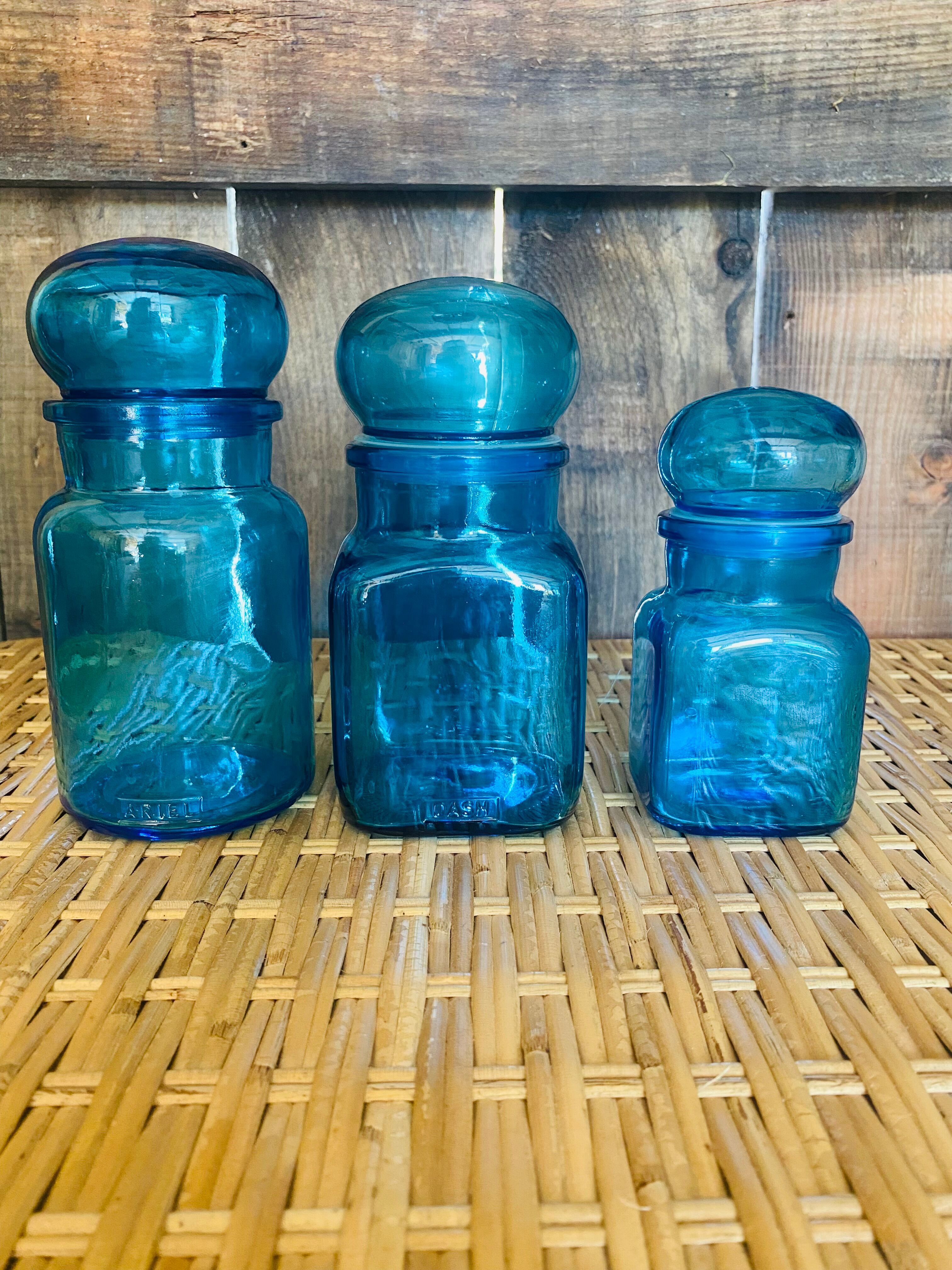 Trio of jars apothecary bottle in blue glass with round cap