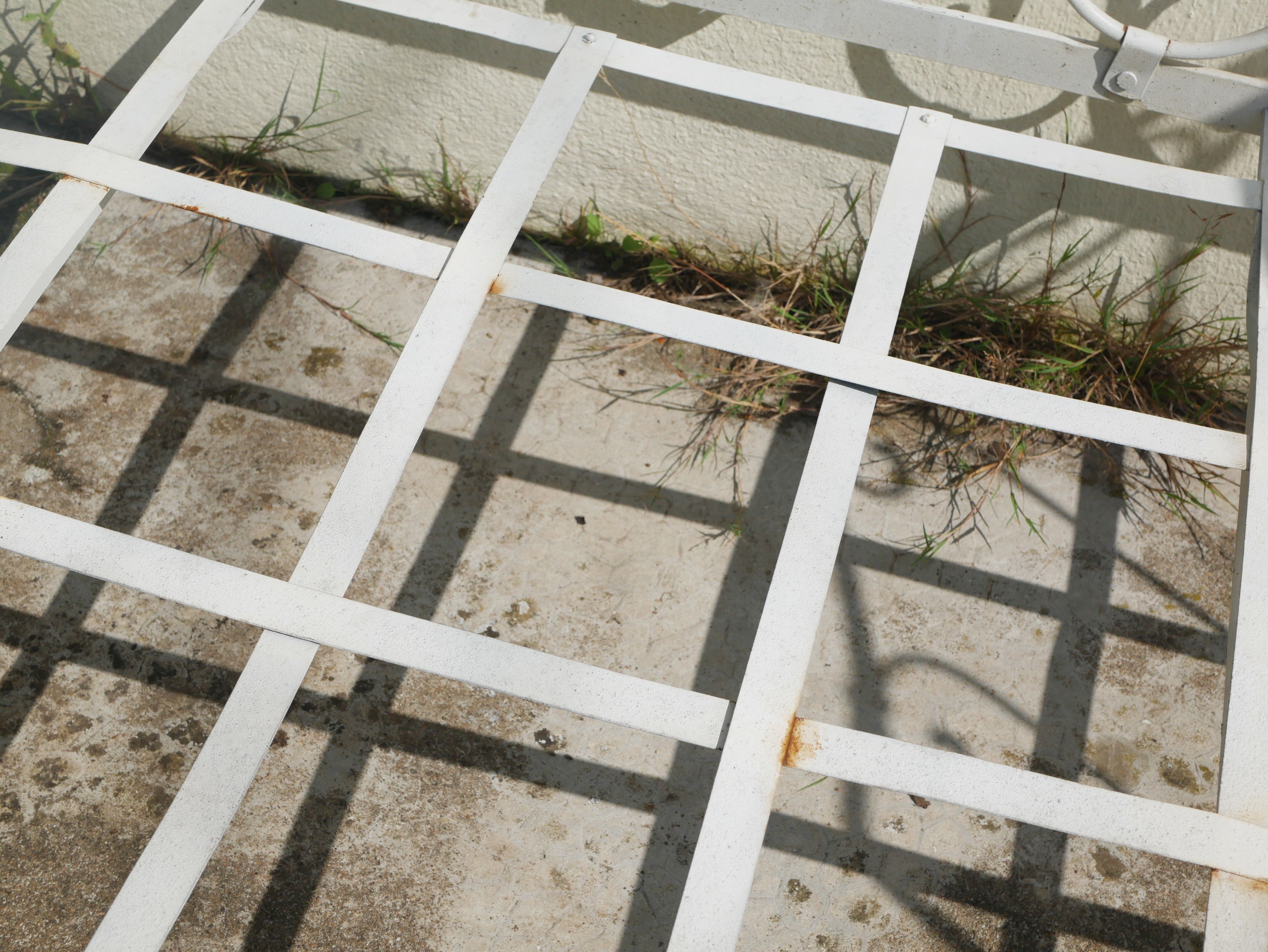 Old wrought iron bed bench